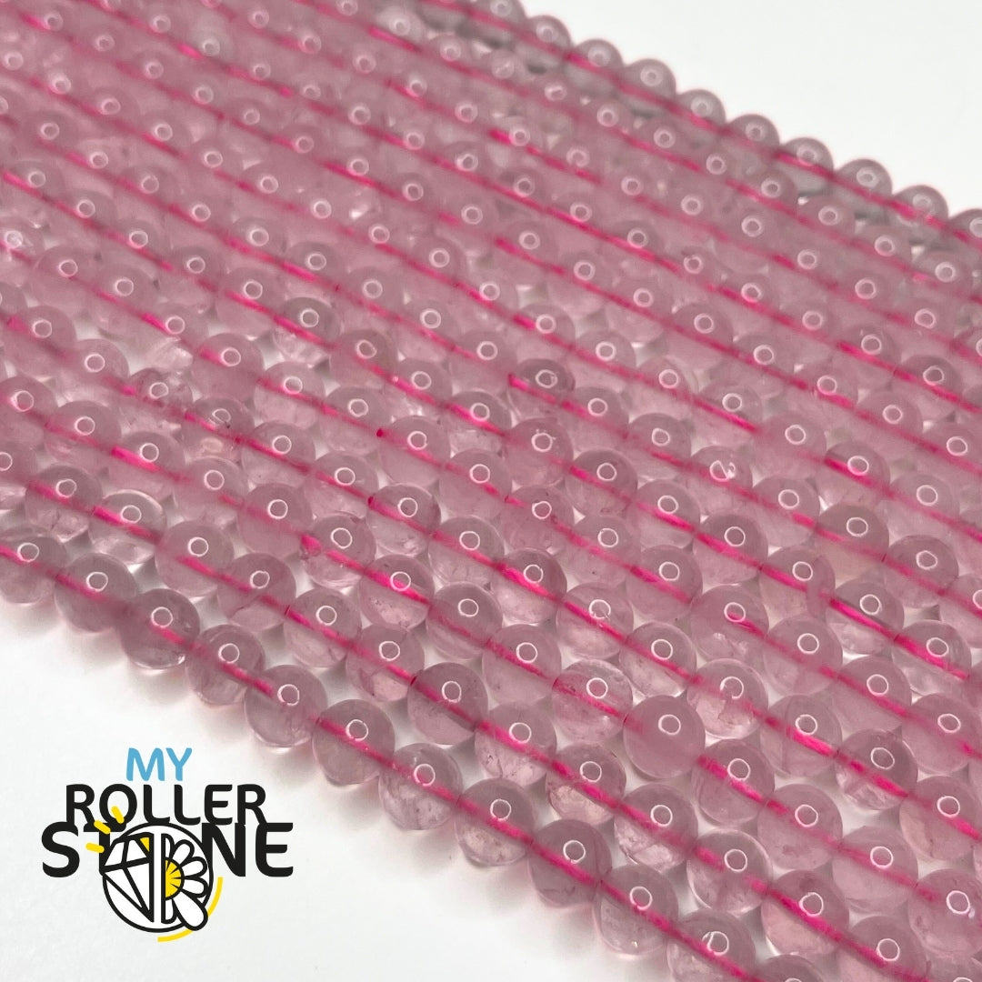 Vue rapprochée de perles rondes en quartz rose 3A