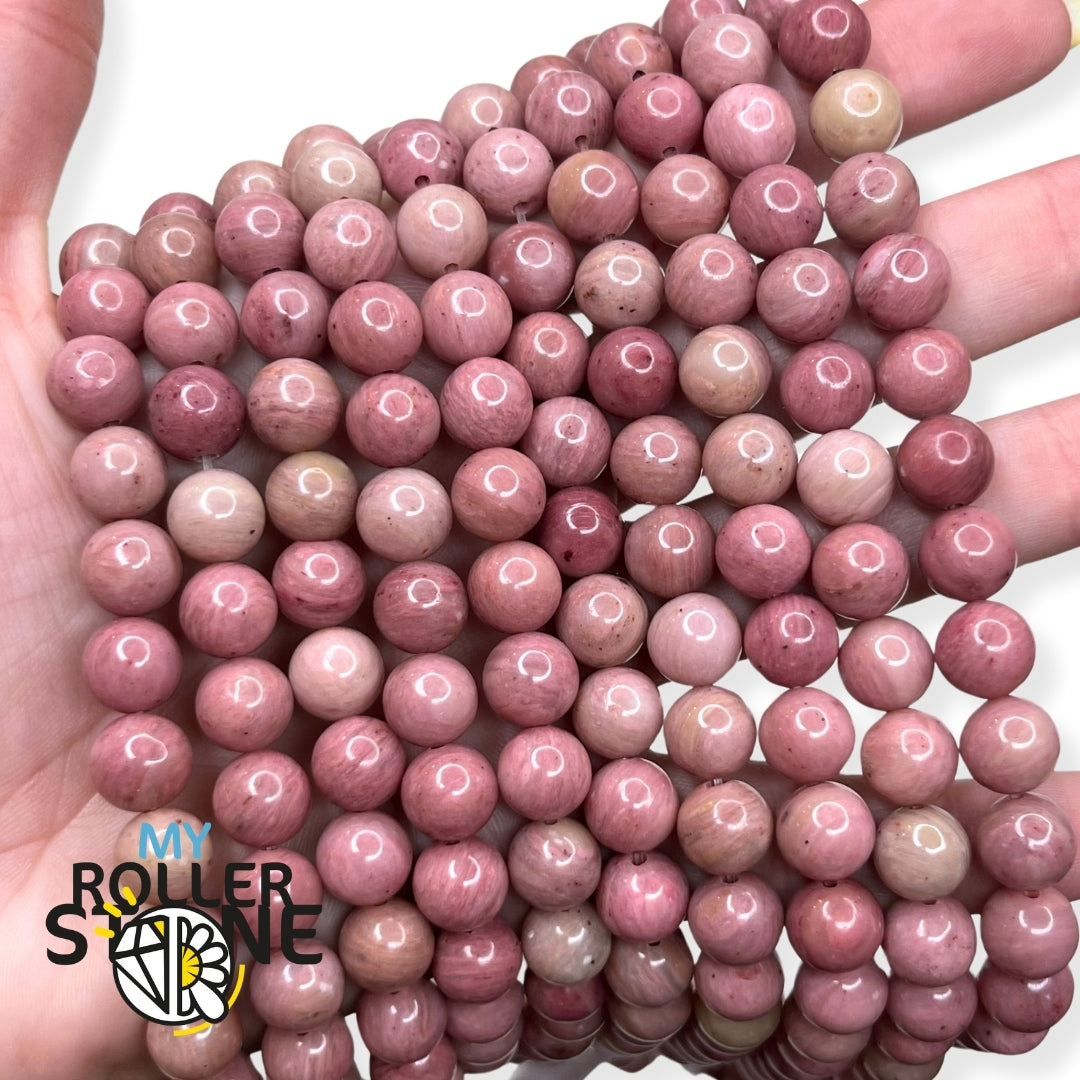 Perles de rhodonite roses avec motifs sombres