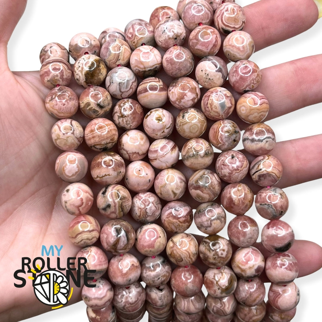 Perles de rhodochrosite roses et veinées